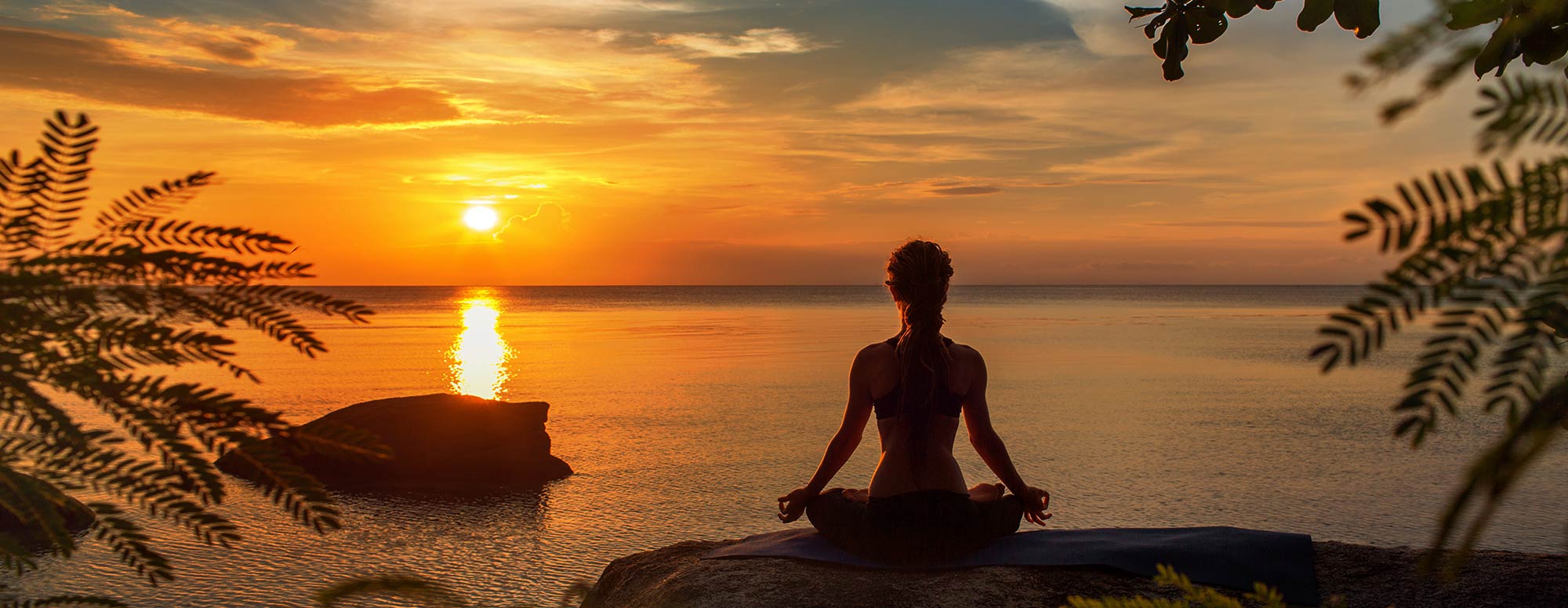 Woman Doing Yoga by Sunset